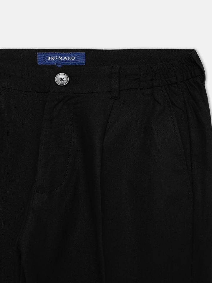 Close up of comfort waist on black cotton linen trousers