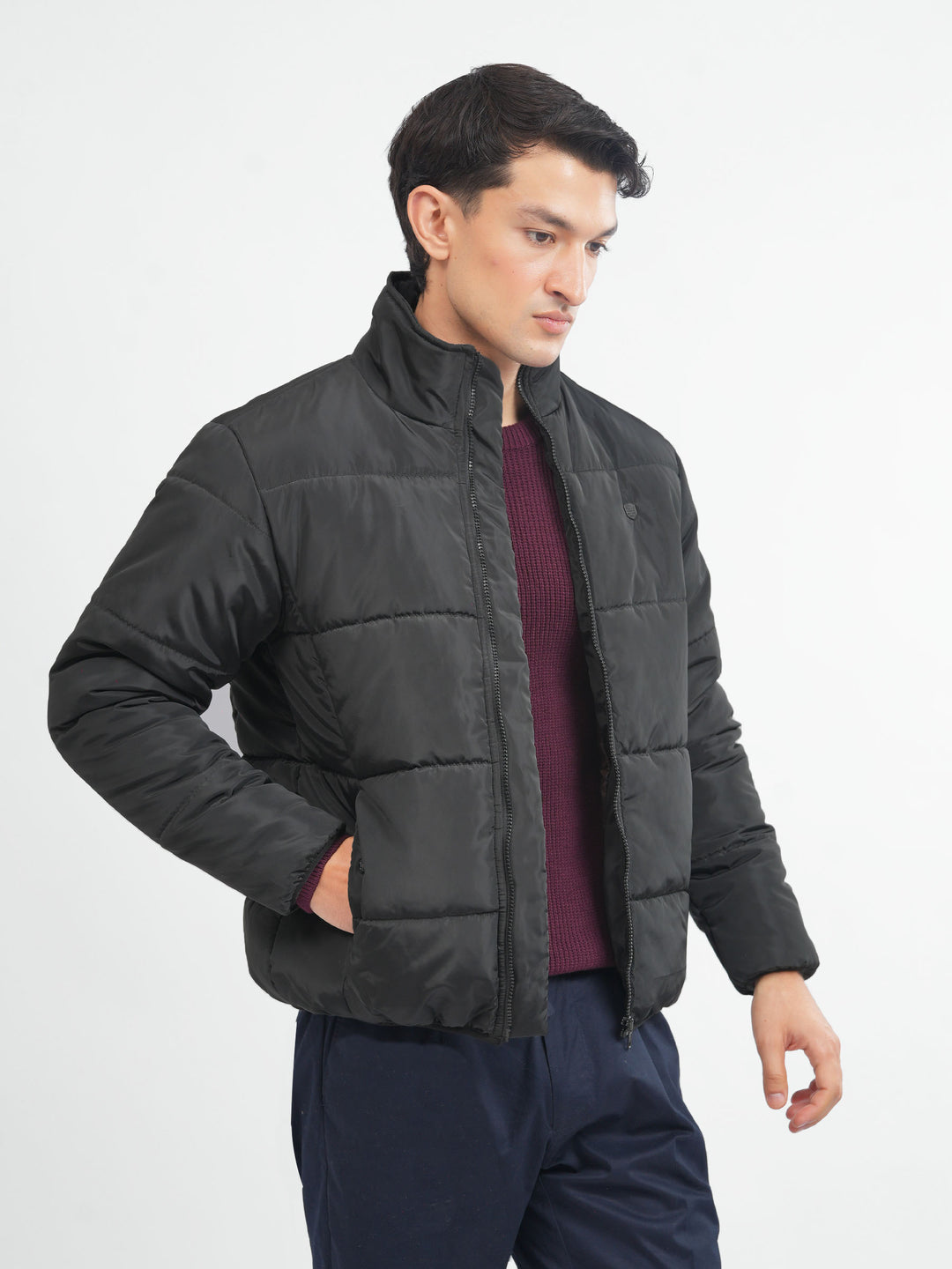 Men's black quilted puffer jacket front view
