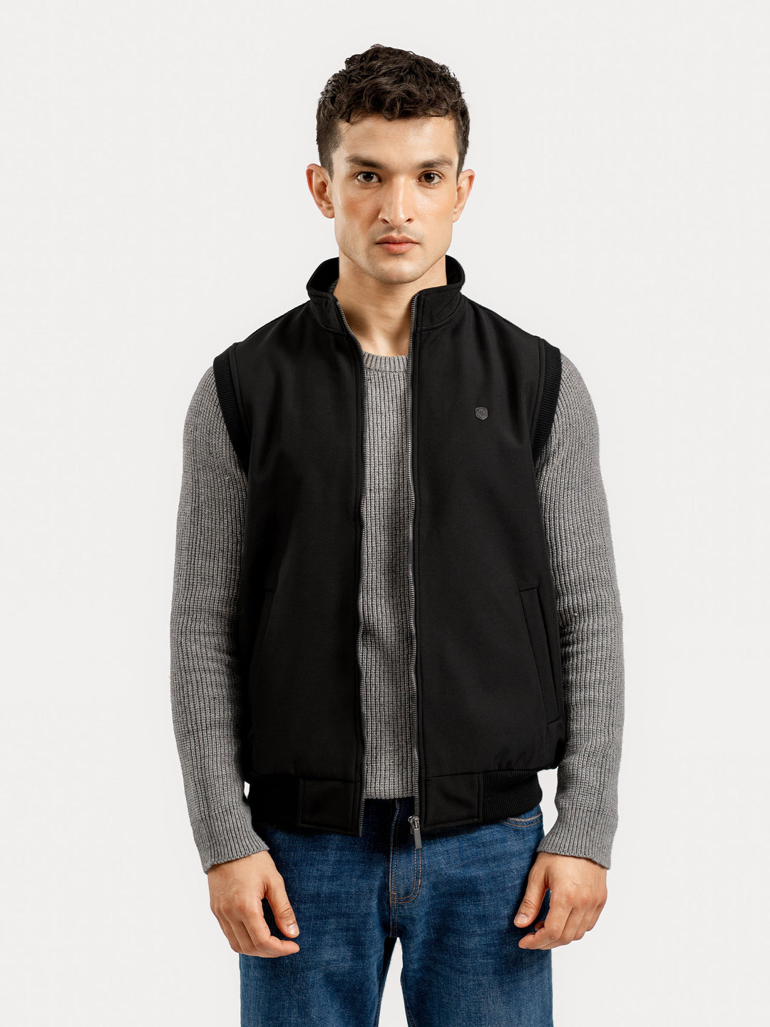 Model wearing black sleeveless winter gilet