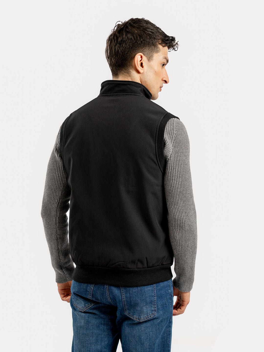 Back view of men's black sleeveless outerwear