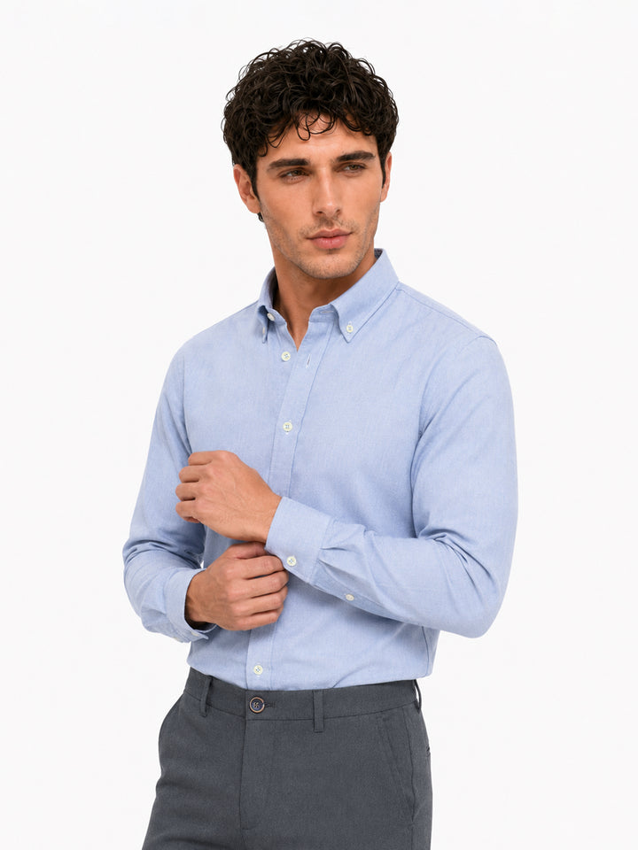 Men wearing blue oxford button down shirt