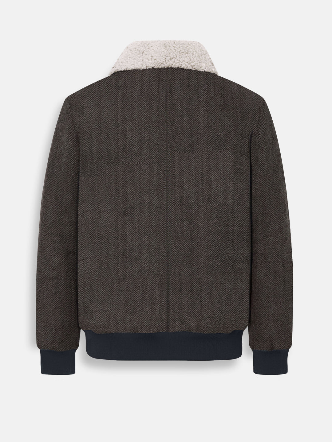 Back view of brown herringbone jacket showing ribbed hem and cuffs