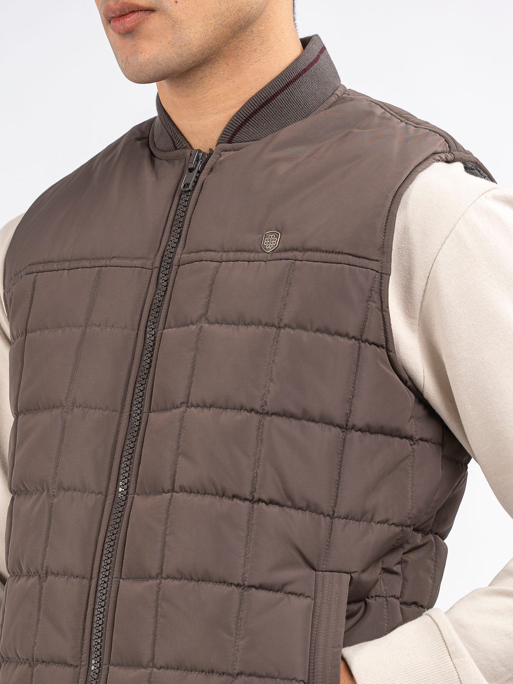 Brownsleevelessquiltedjacketwithsportybaseballcollar