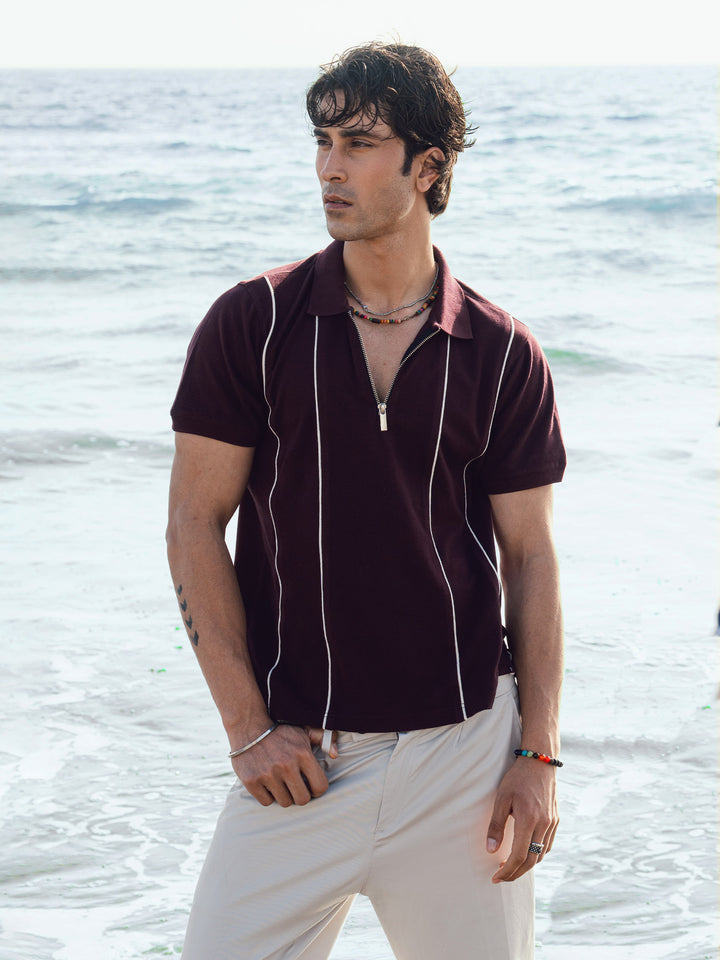 Man wearing burgundy front striped polo for smart casual look