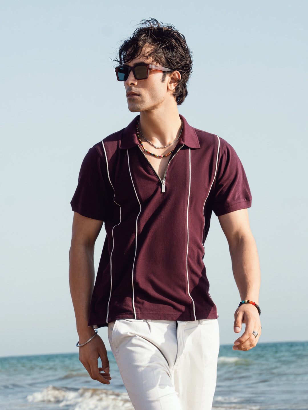 Men's burgundy zipper polo with front striped design