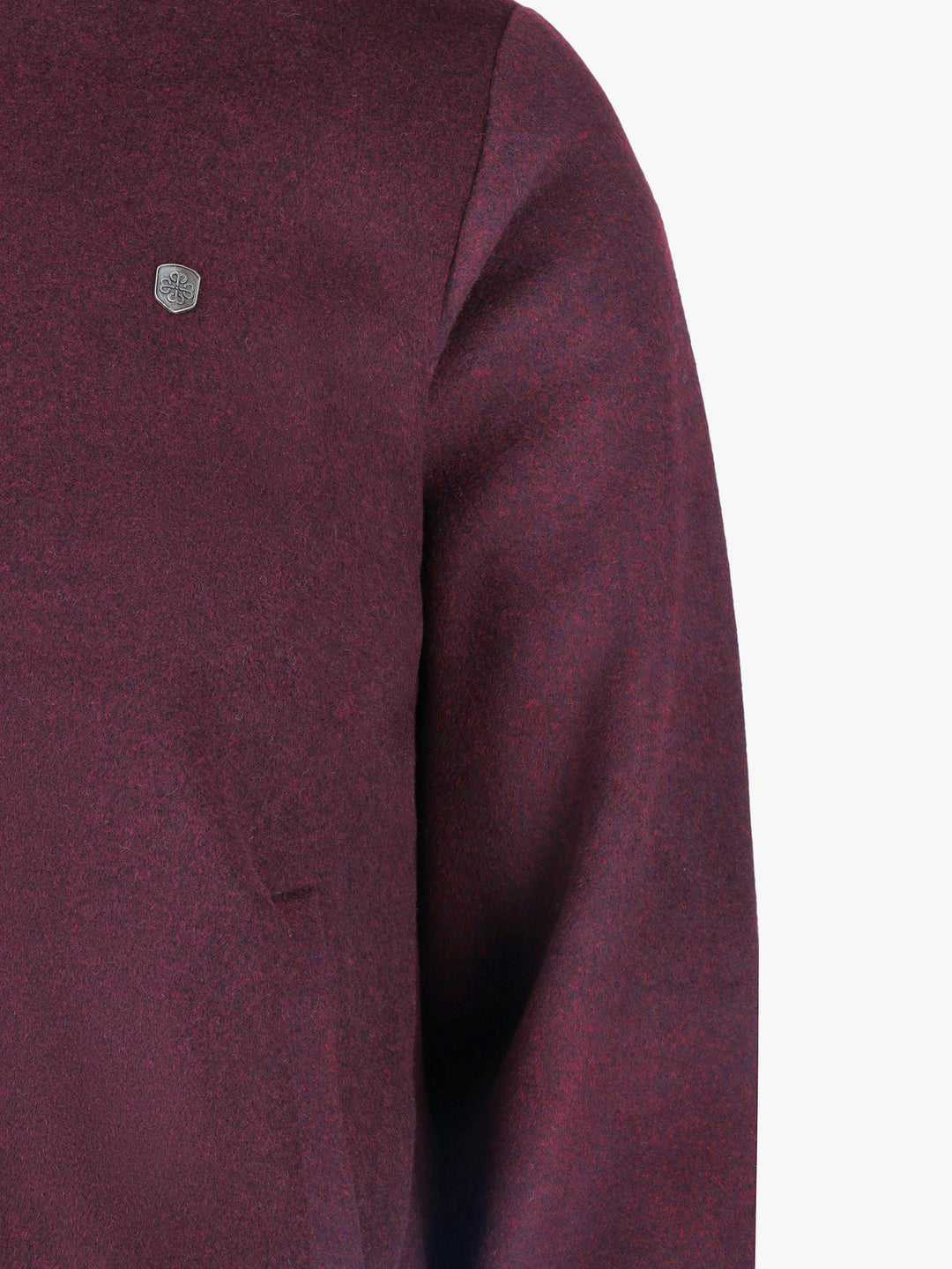Texture detail of felted wool blend fabric in burgundy