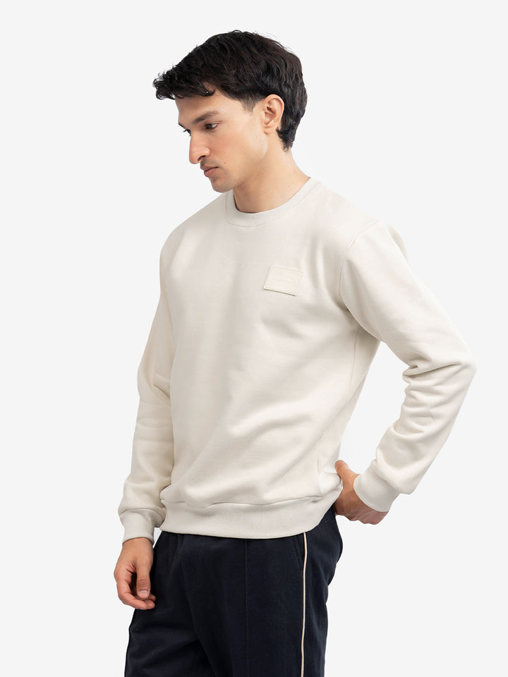 Close up of cream cotton blend sweatshirt fabric texture