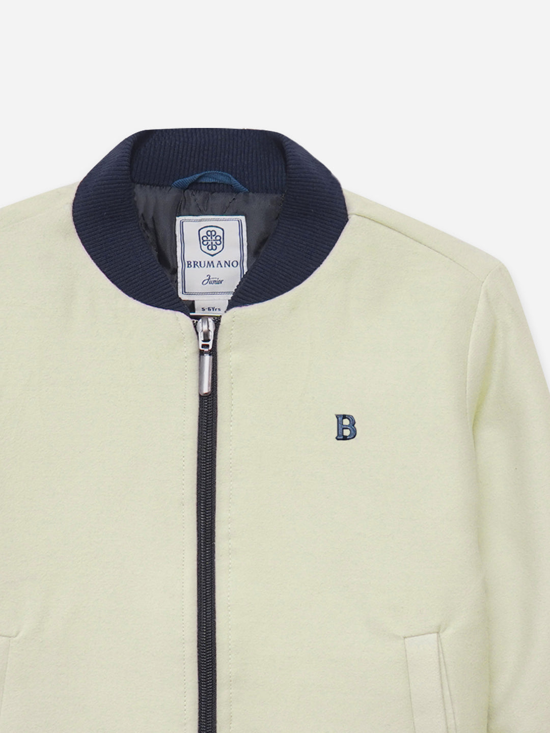 Close up of quilted texture on cream jacket