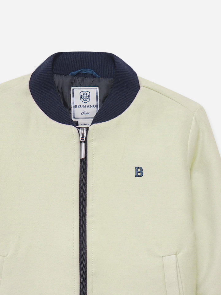 Close up of quilted texture on cream jacket