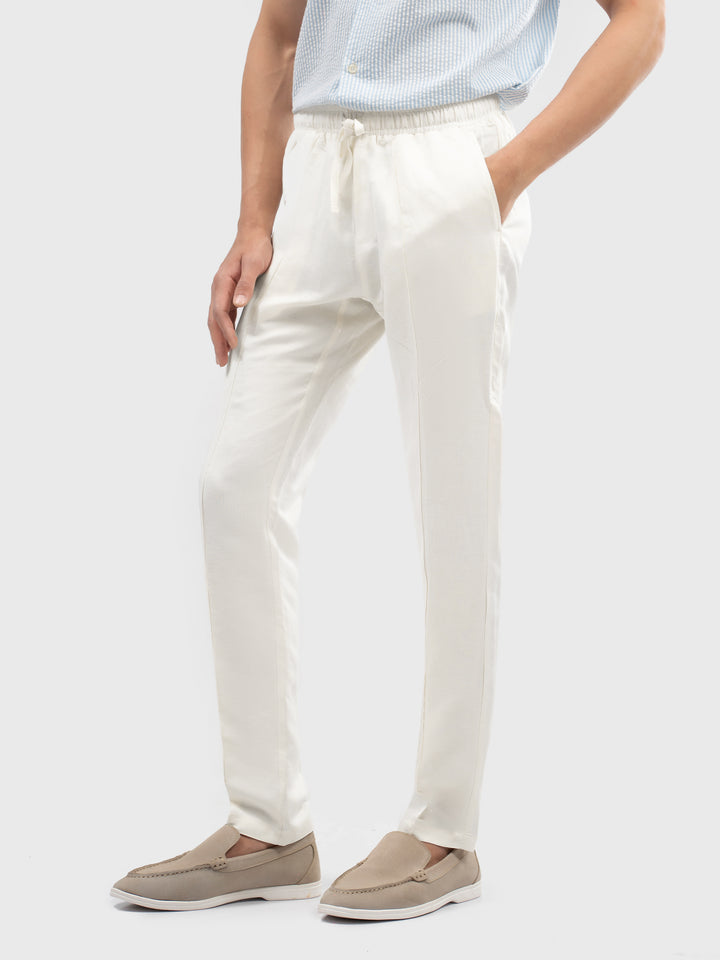 Man wearing cream casual loungewear pajama side profile