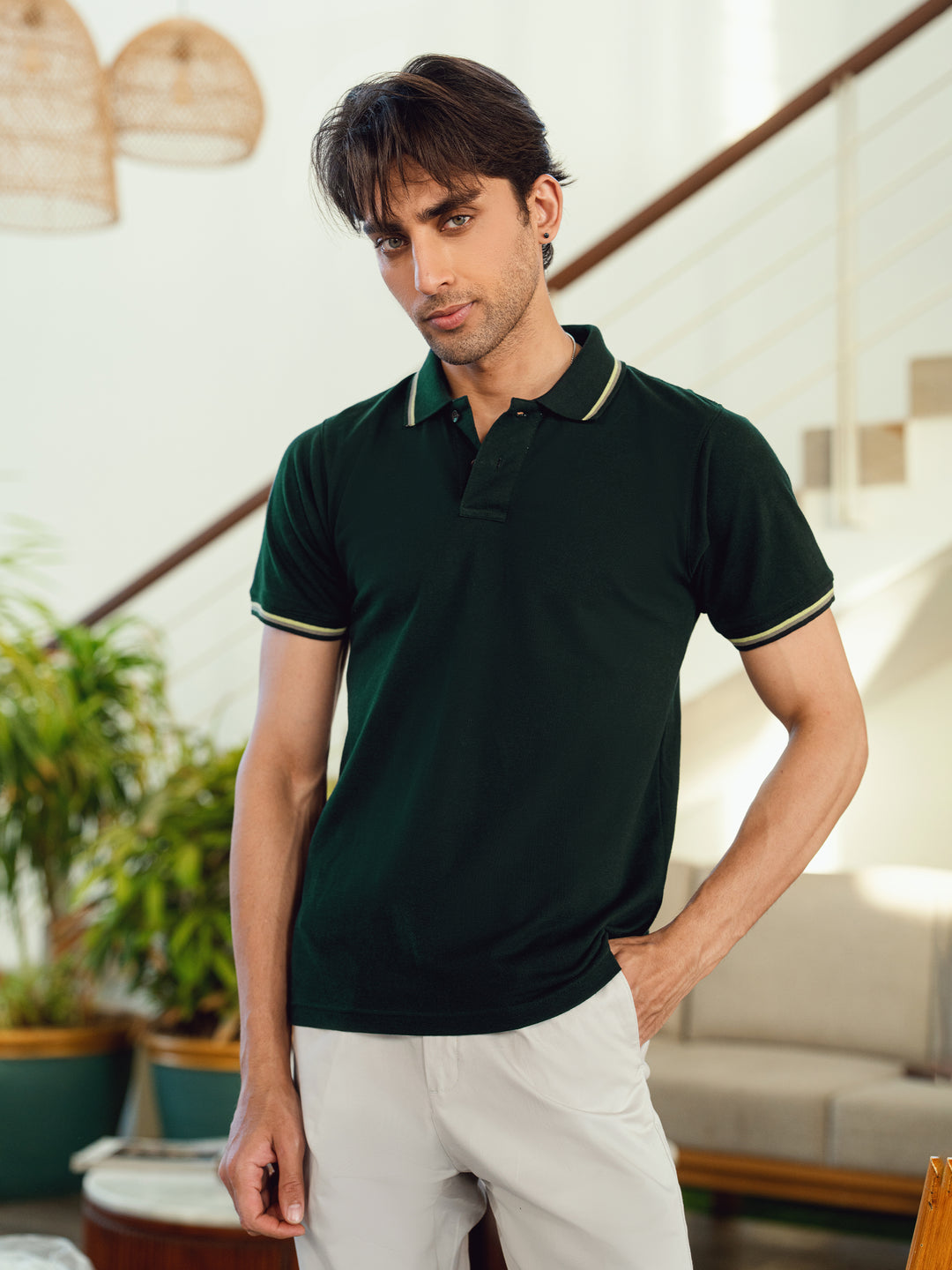 Men's green pique polo shirt with multicolor tipped collar front view