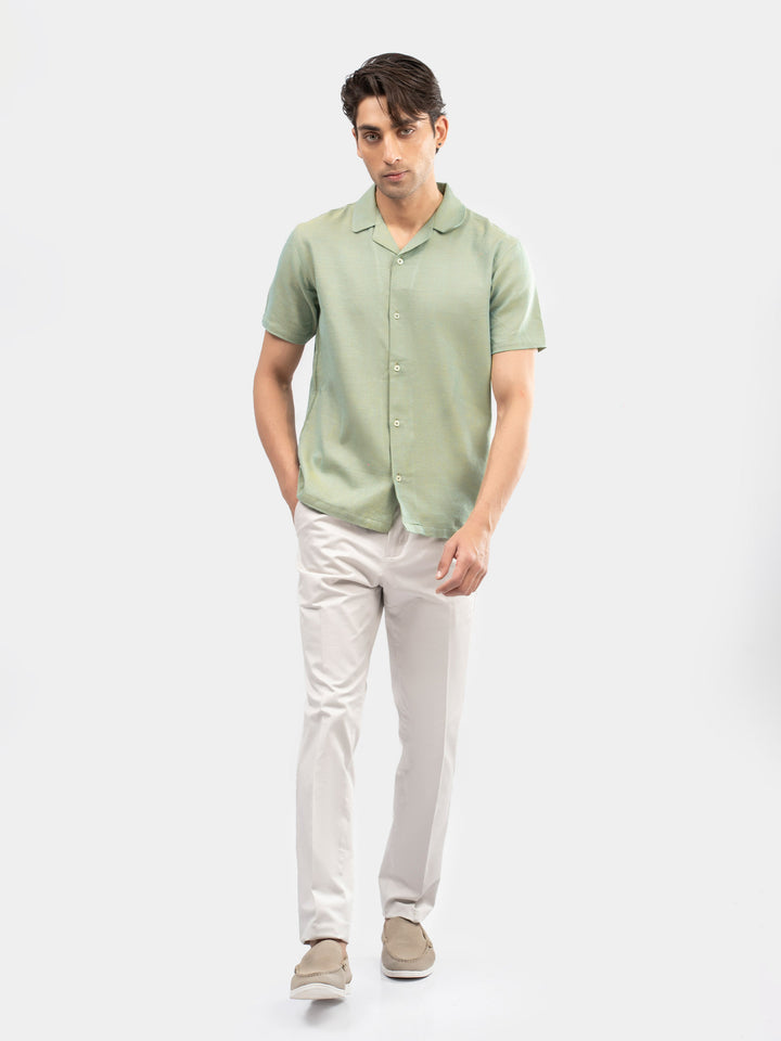 Man wearing casual green cuban collar shirt 