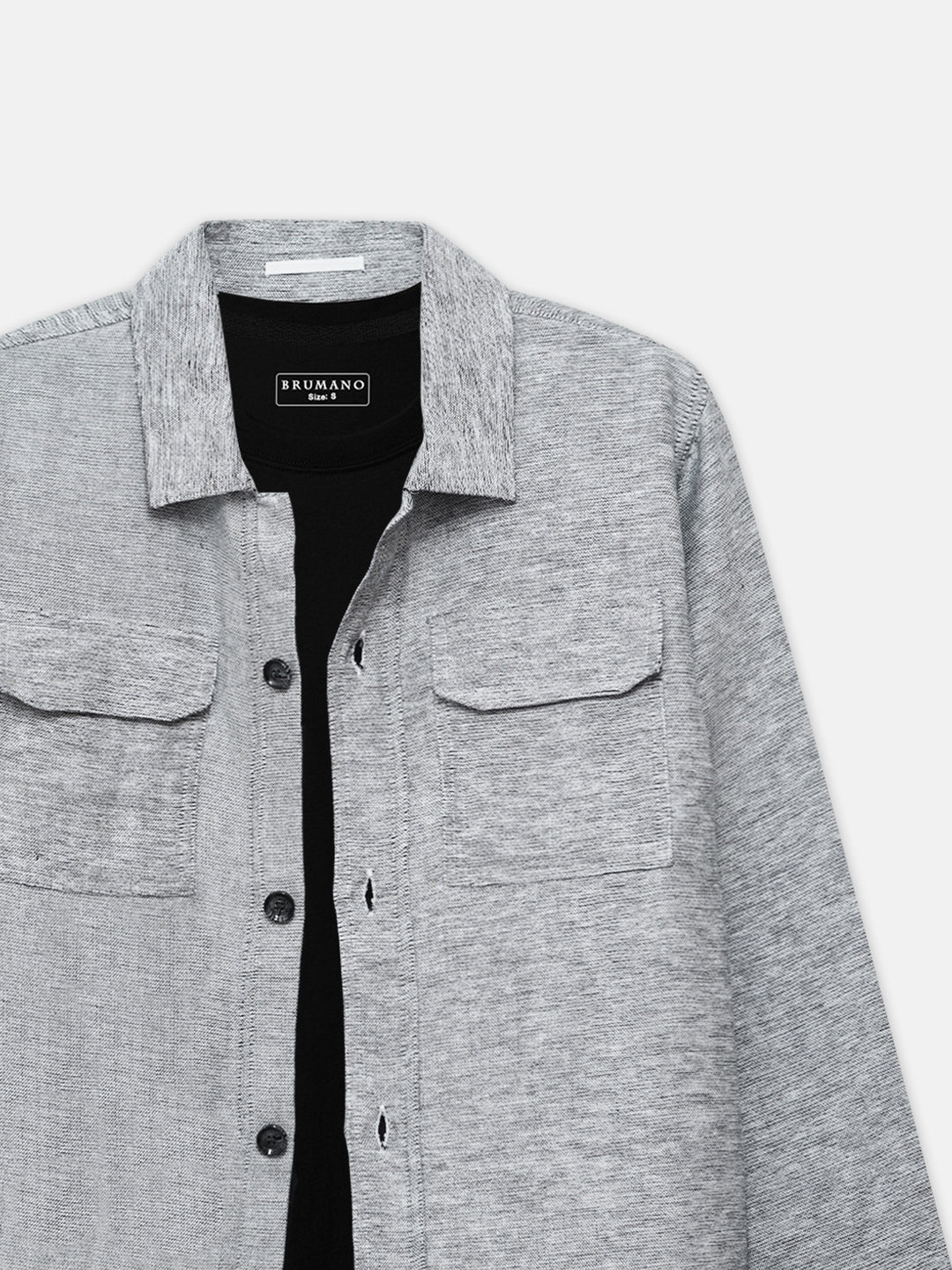 Close up of front flap pockets on grey over-shirt