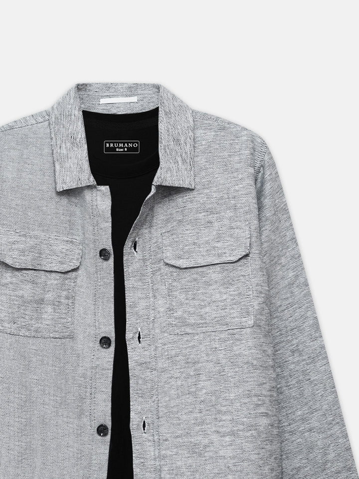 Close up of front flap pockets on grey over-shirt