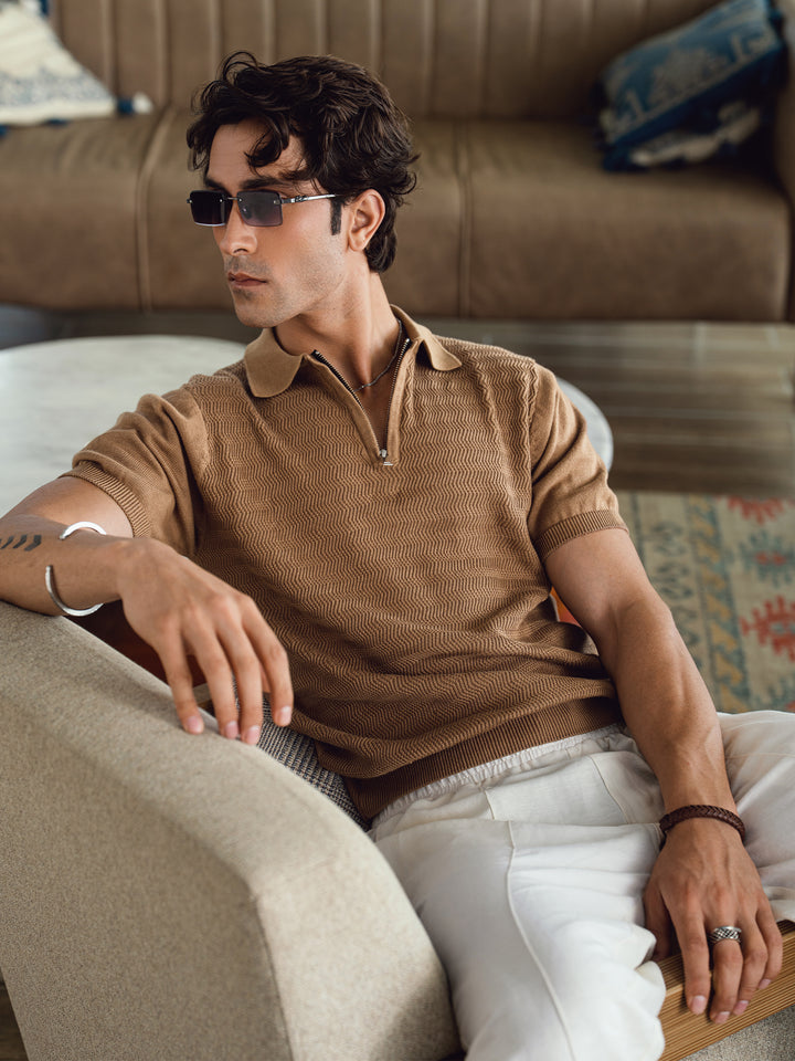 Textured flat knit fabric detail on men's mid brown polo shirt