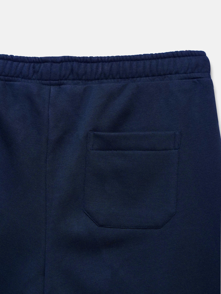 Back view of navy blue fleece sleepwear trousers with back pocket