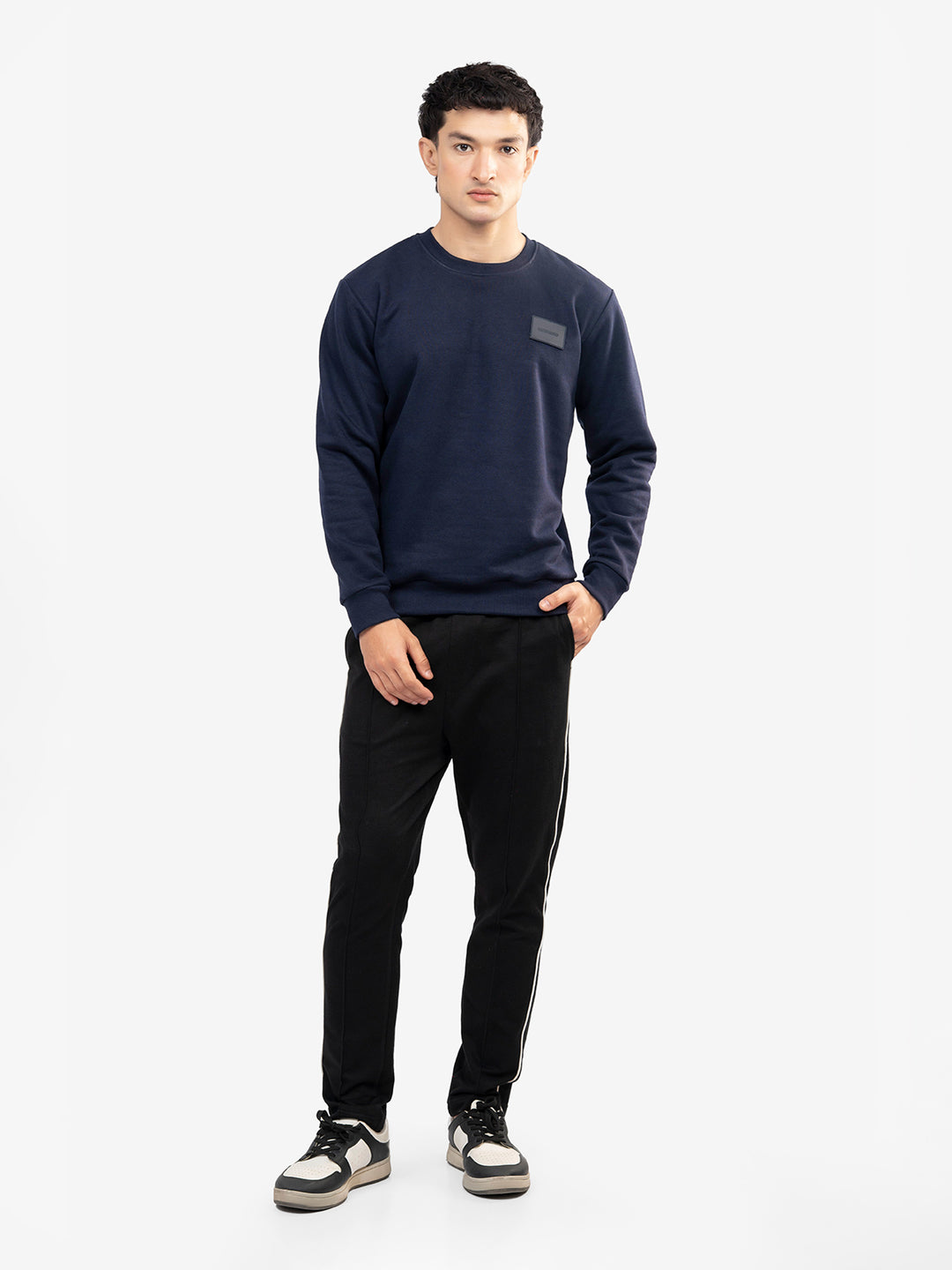 Model wearing navy blue winter sweatshirt in Pakistan