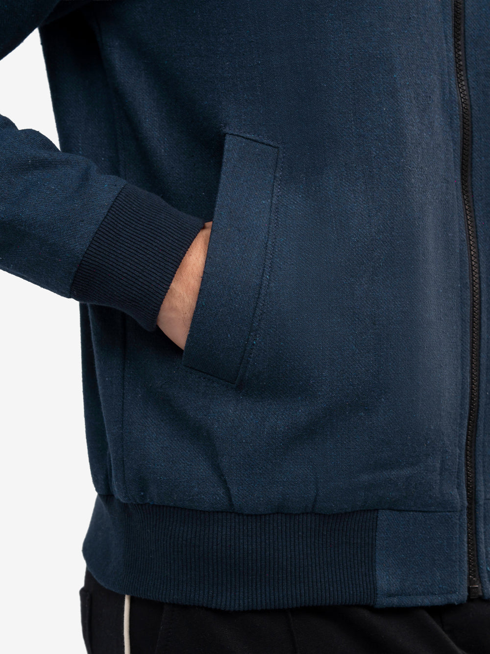 Close up of zipper detail on navy jacket
