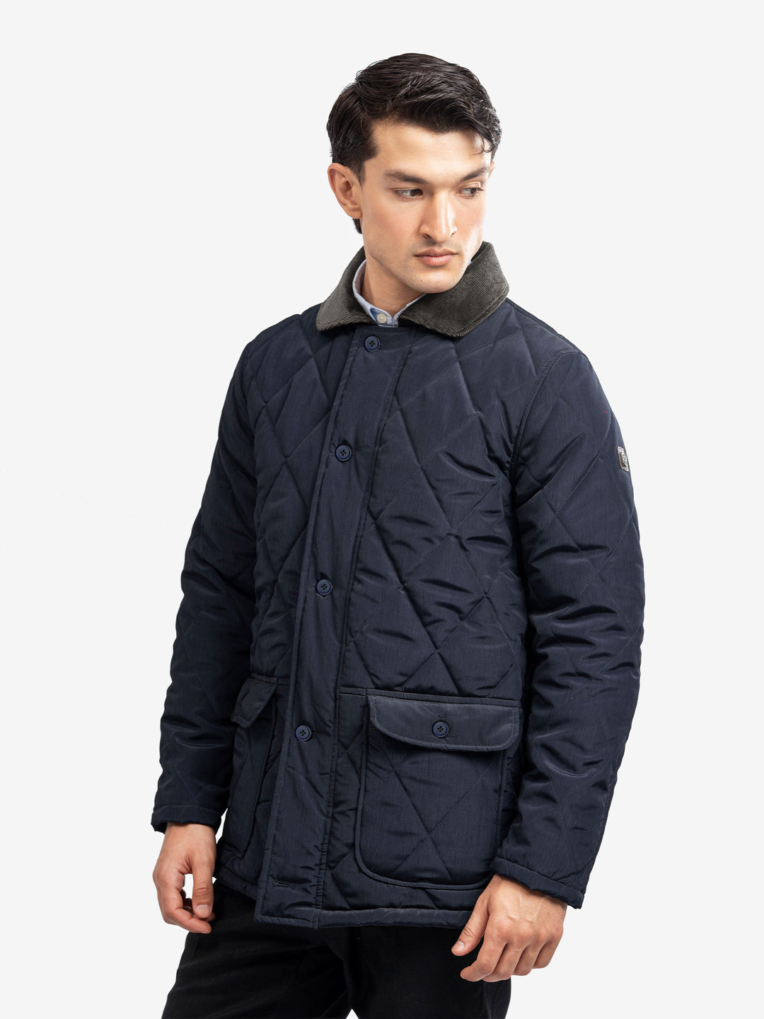 Side profile of long quilted winter jacket