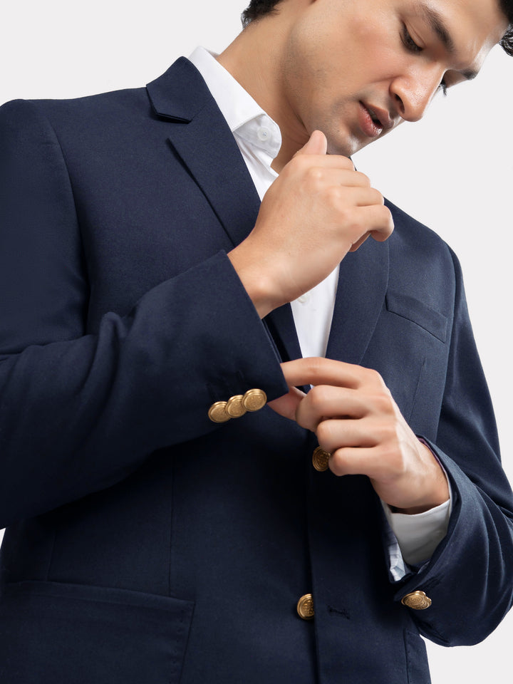 Close-up of golden buttons on poly-viscose navy blazer
