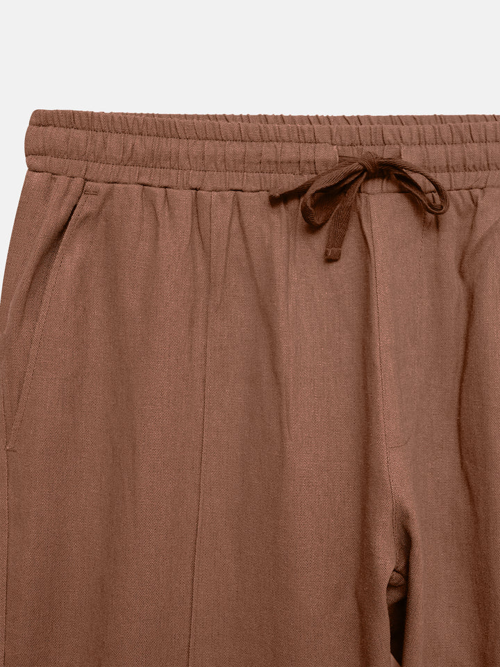 Close-up of breathable cotton linen blend fabric in rusty orange