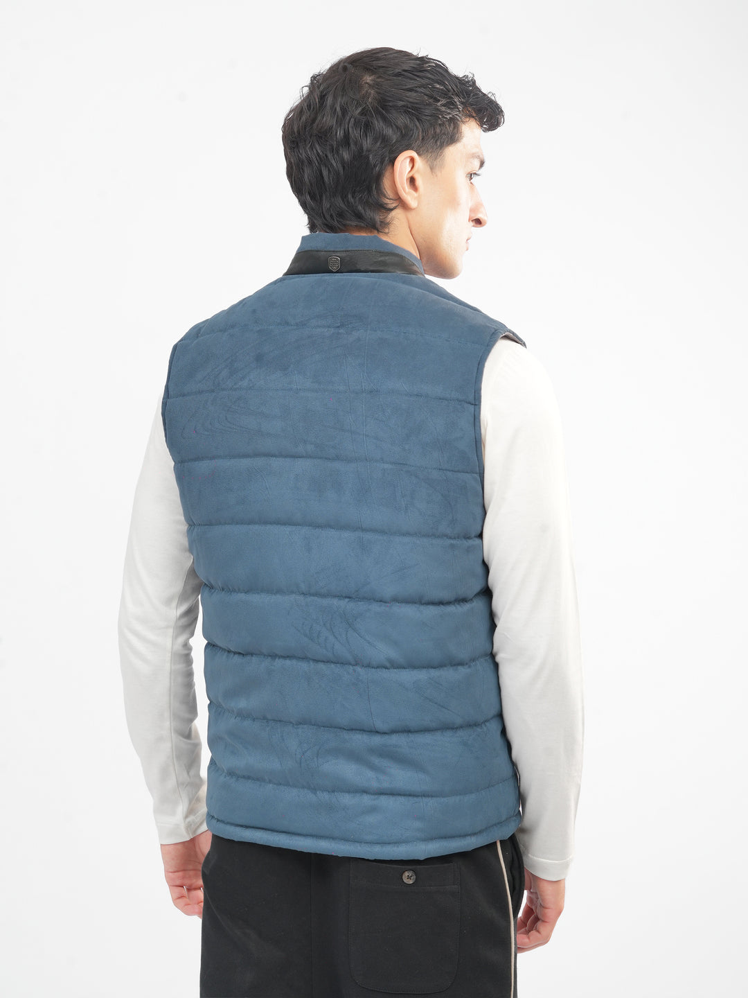 Back view of slate blue sleeveless jacket