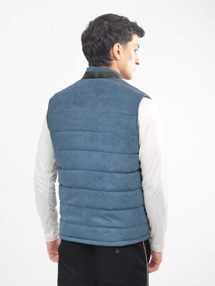 Back view of slate blue sleeveless jacket