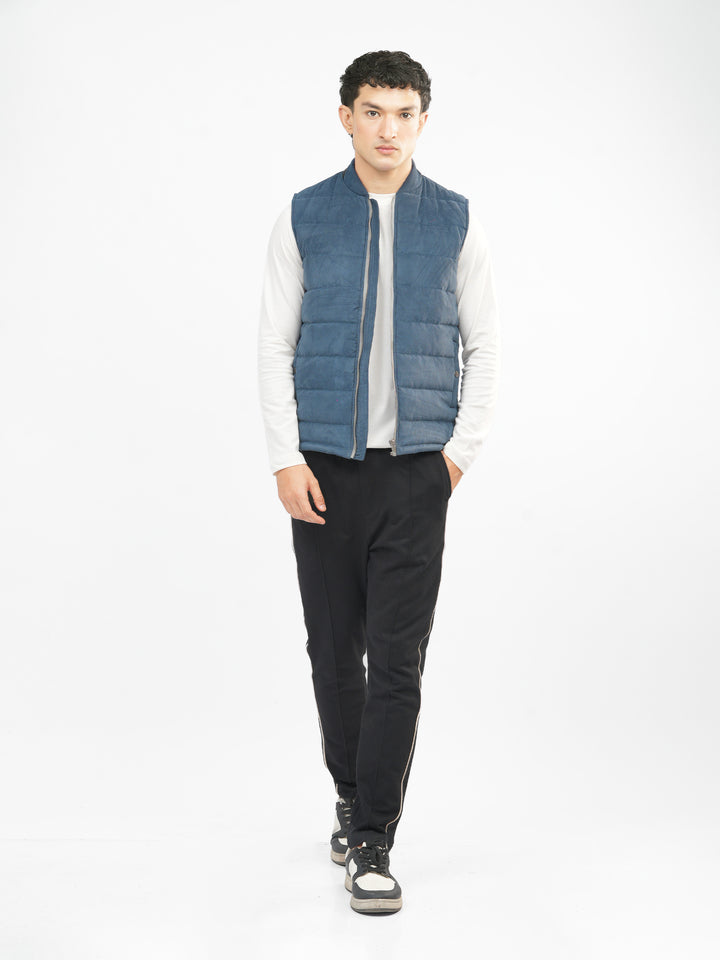 Man wearing slate blue gilet layered outfit
