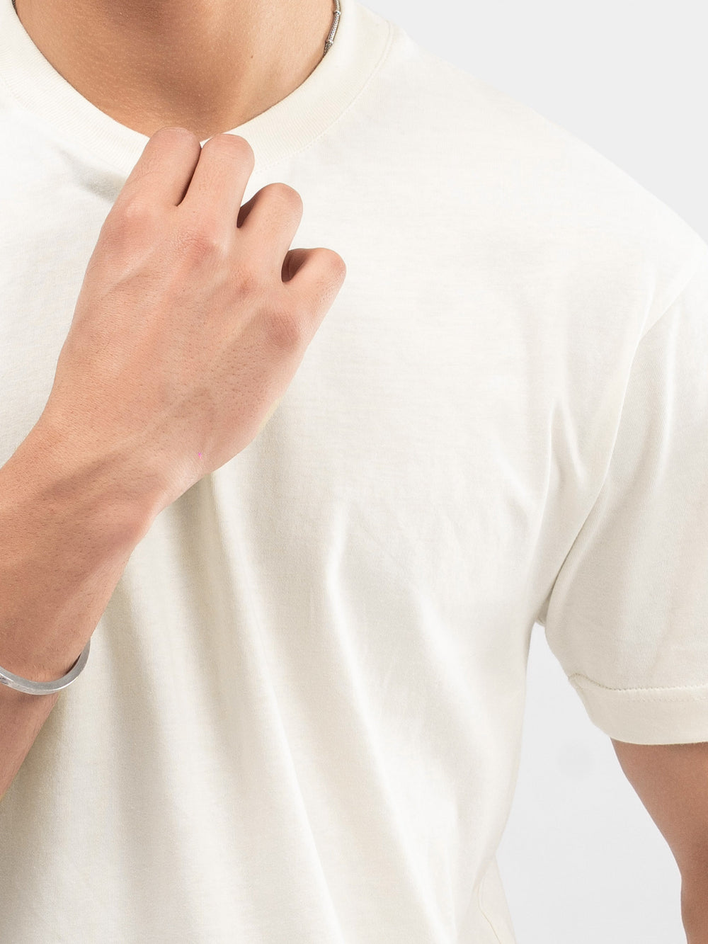 Close up of 100% cotton fabric texture on vanilla t shirt