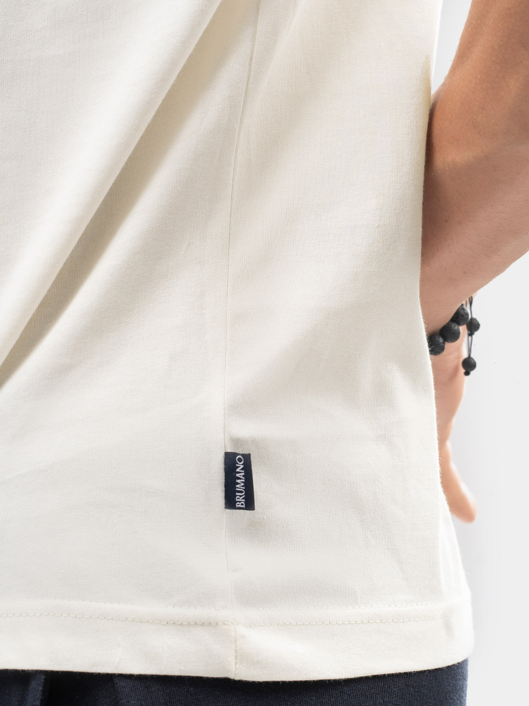 Close up of 100% cotton fabric texture on vanilla t-shirt
