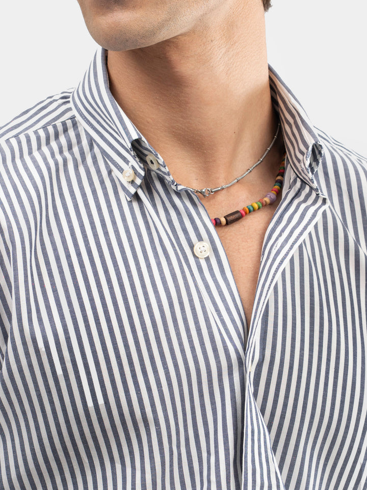 Close up of button-down collar on men's striped shirt