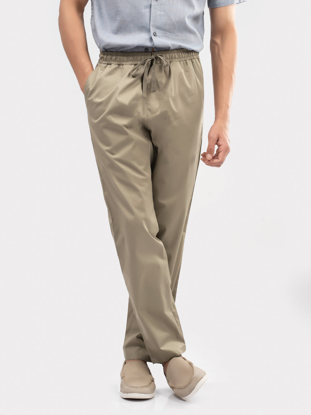 Man wearing relaxed fit khaki loungewear bottoms